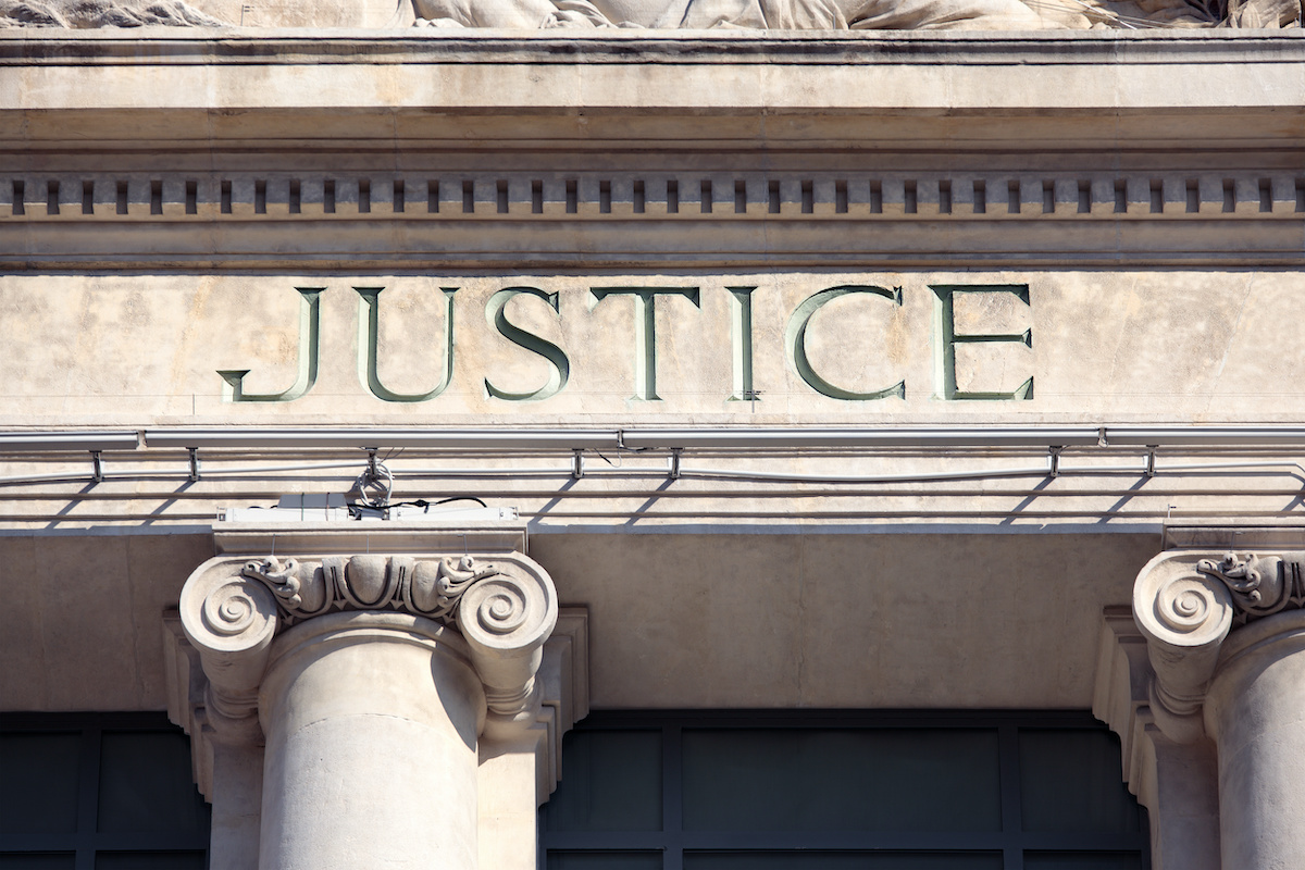 The word Justice carved into Courthouse Building