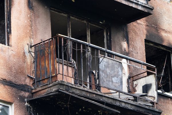 A severely burned apartment that has been rendered uninhabitable due to landlord negligence.