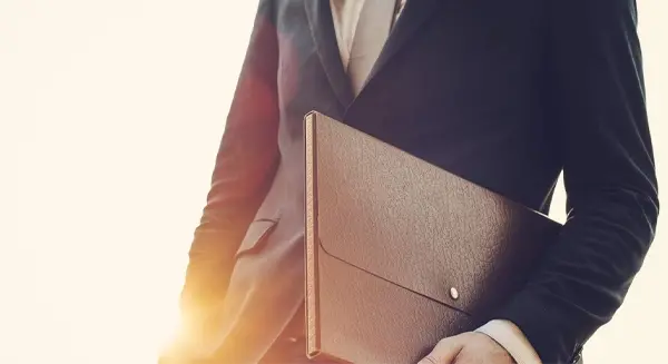 Business man holding a briefcase.