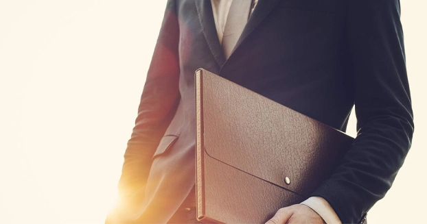 Business man holding a briefcase.