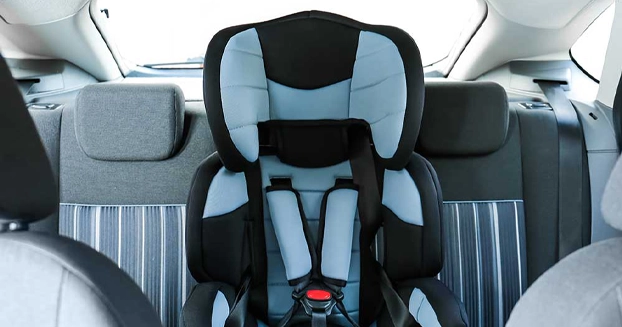 empty child carseat in the back seat of a car.