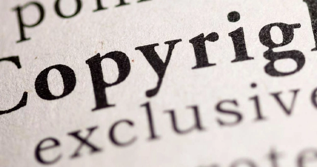 close up of a page in a book on the word "copyright".
