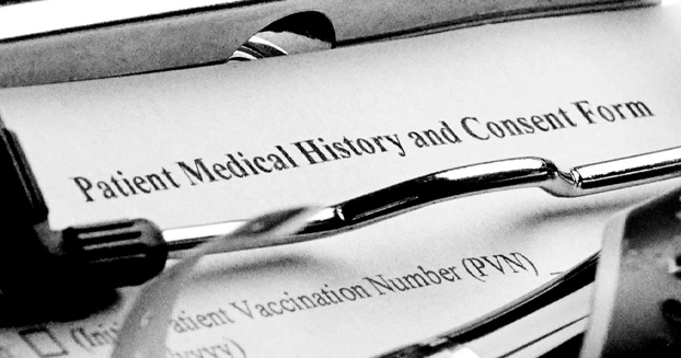 Clip board with a medical history form attached.