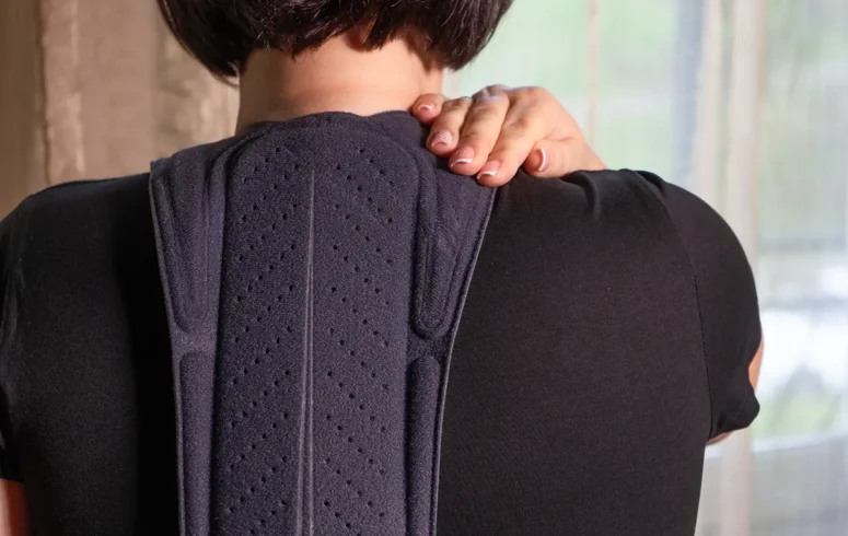 injured person in back brace