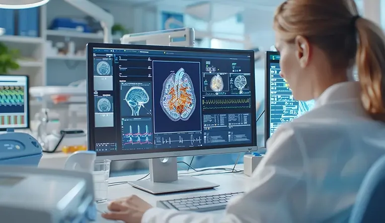 doctor looking at brain scan on computer