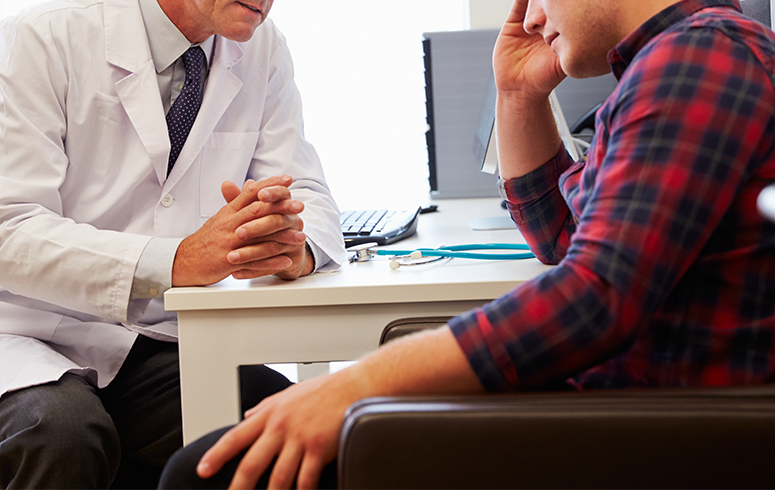 testosterone Replacement doctor sittin with man