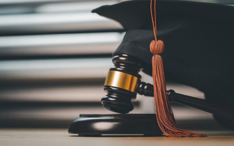 Black Graduation Hat and Gavel Concept of law school.